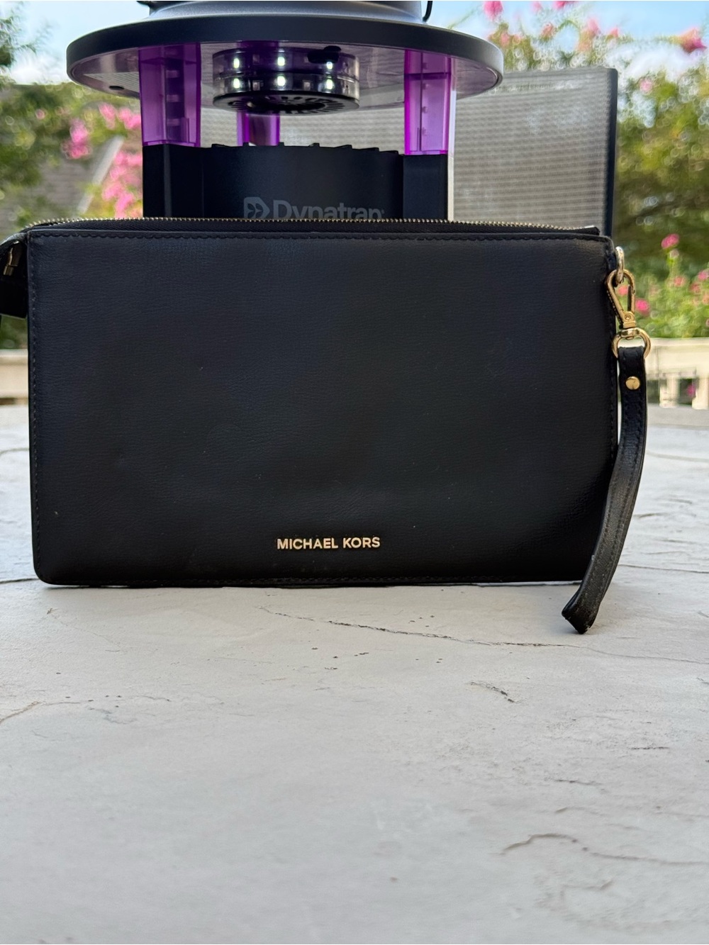 Stylish Michael Kors black wristlet clutch featuring gold-tone geometric stud